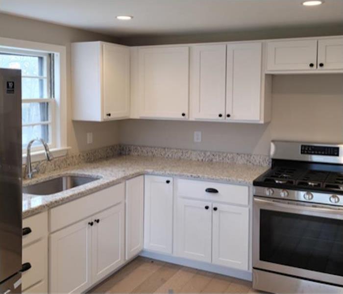 kitchen with white cabinets and granite countertop