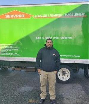 Edwin Carrasquillo near a SERVPRO truck