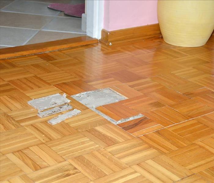 parquet floor lifting from water damage