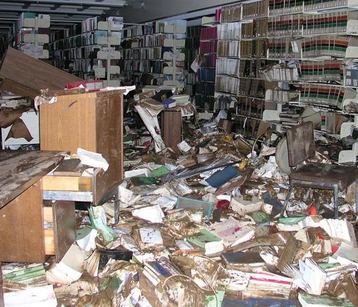 shelves full of wet damaged books