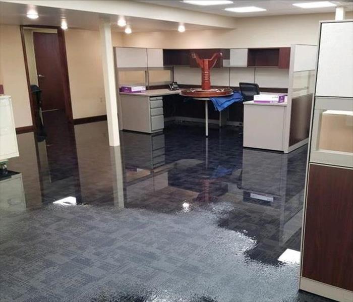 An office with standing water on the floor